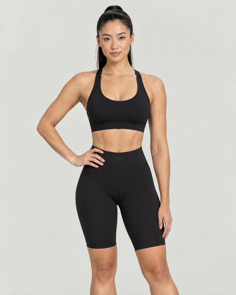 Conjunto Sculpt · top cruzado y pantalón ciclista, color negro, delante